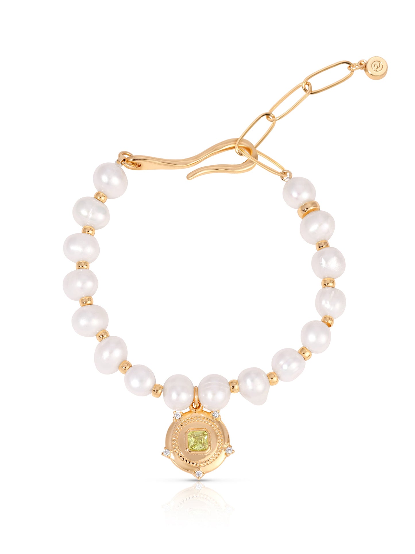 Penelope freshwater pearl bracelet with gold hook closure and pale green cubic zirconia charm on white background. 