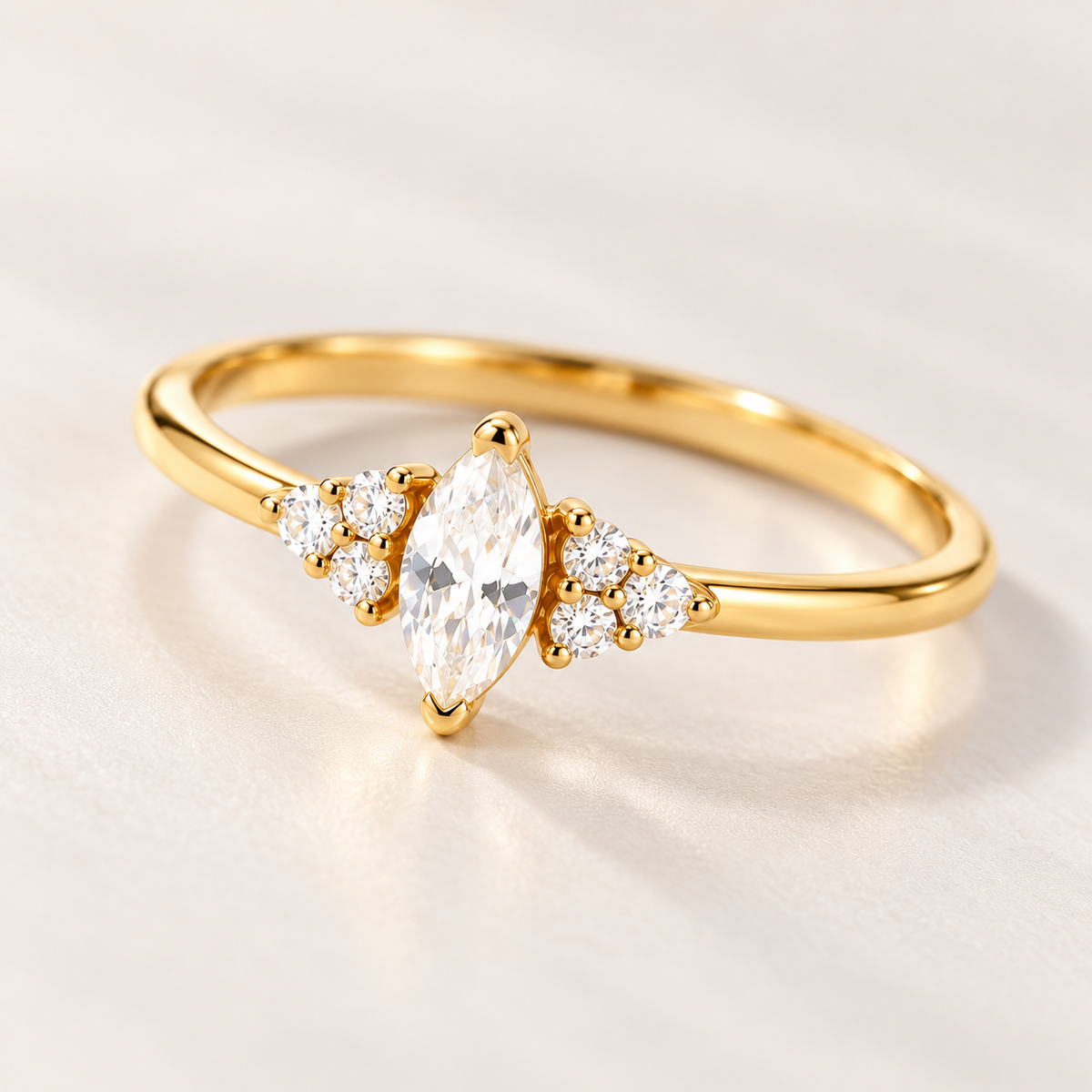 Close-up of gold Ari Marquise Ring with marquise cubic zirconia center stone and side stones
