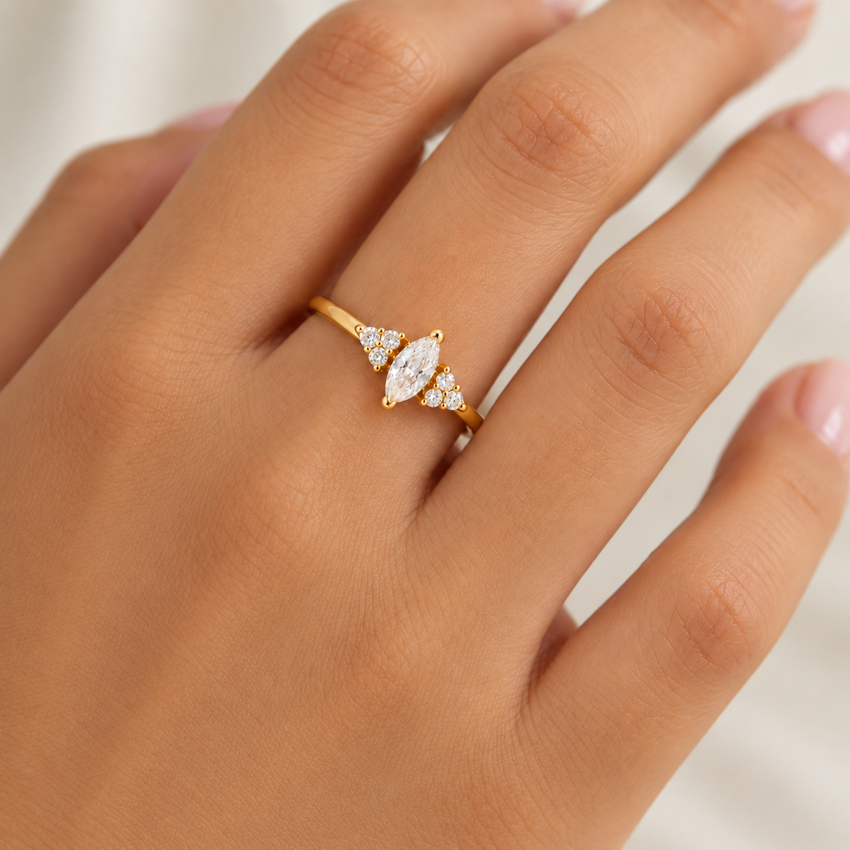 Gold Ari Marquise Ring with marquise cubic zirconia worn on hand