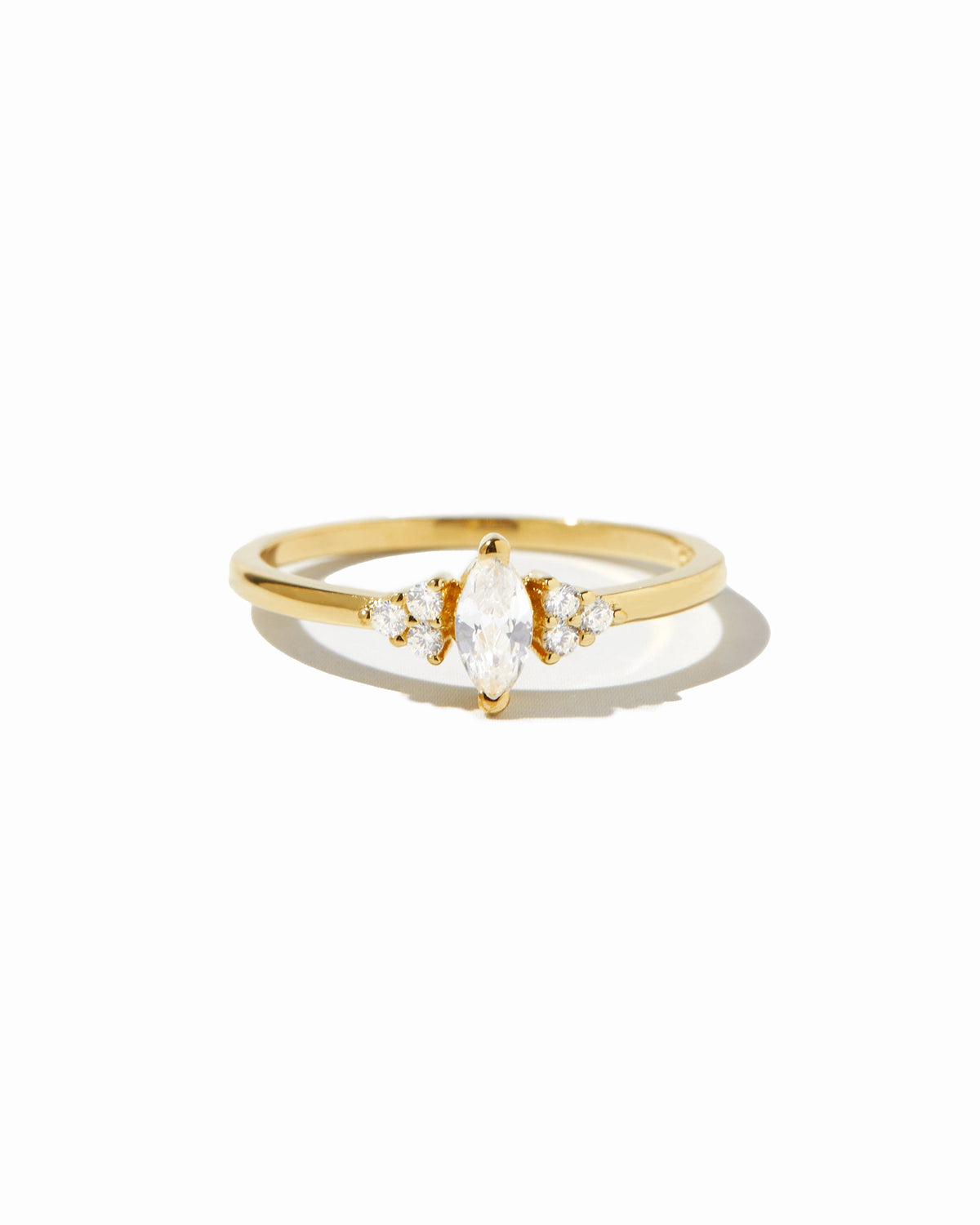 Side view of gold Ari Marquise Ring showing the sterling silver band and marquise setting
