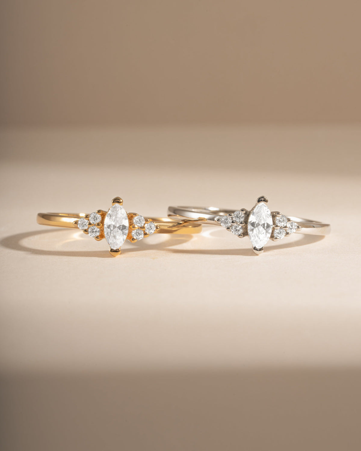 Gold and silver Ari Marquise Rings shown together with cubic zirconia stones