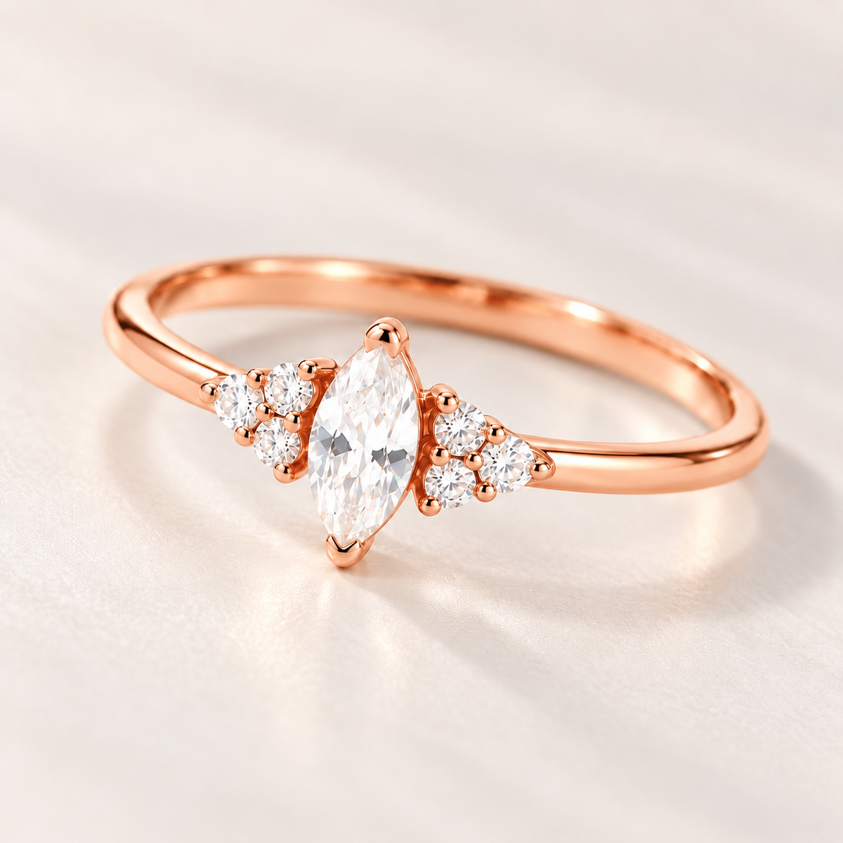 Close-up of rose gold Ari Marquise Ring with marquise cubic zirconia center stone and side stones