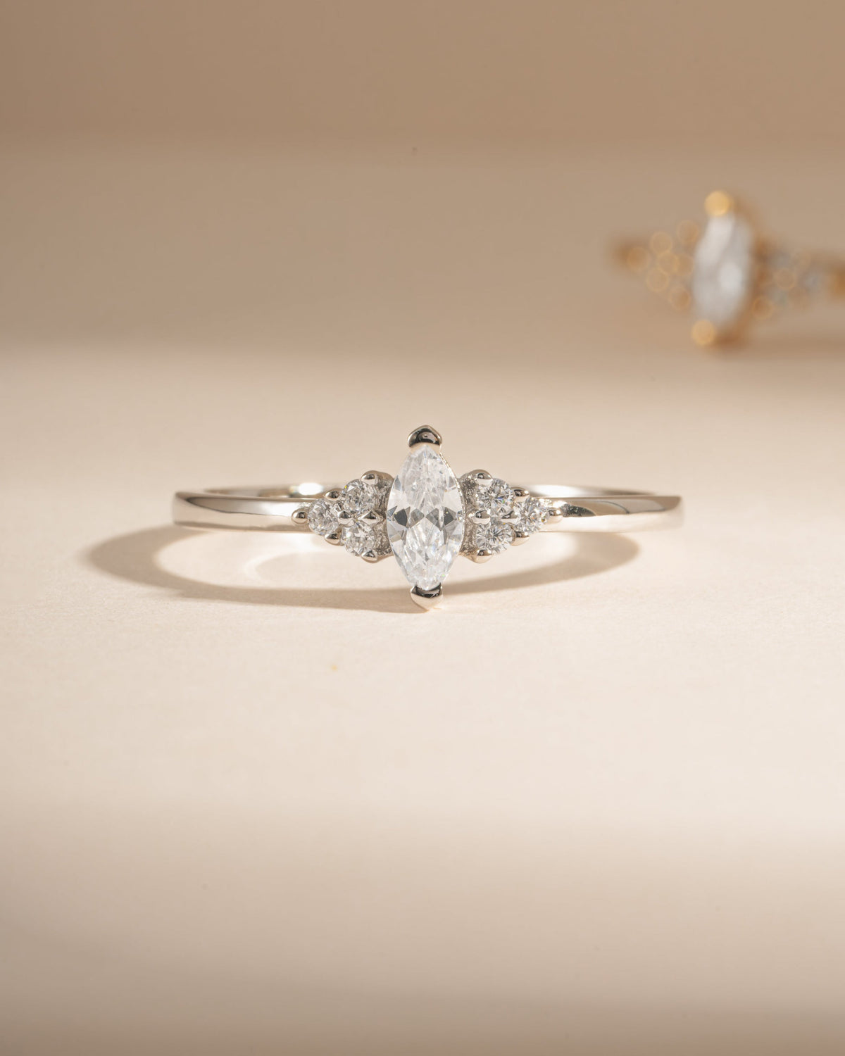 Close-up of silver Ari Marquise Ring with marquise cubic zirconia center stone and side stones
