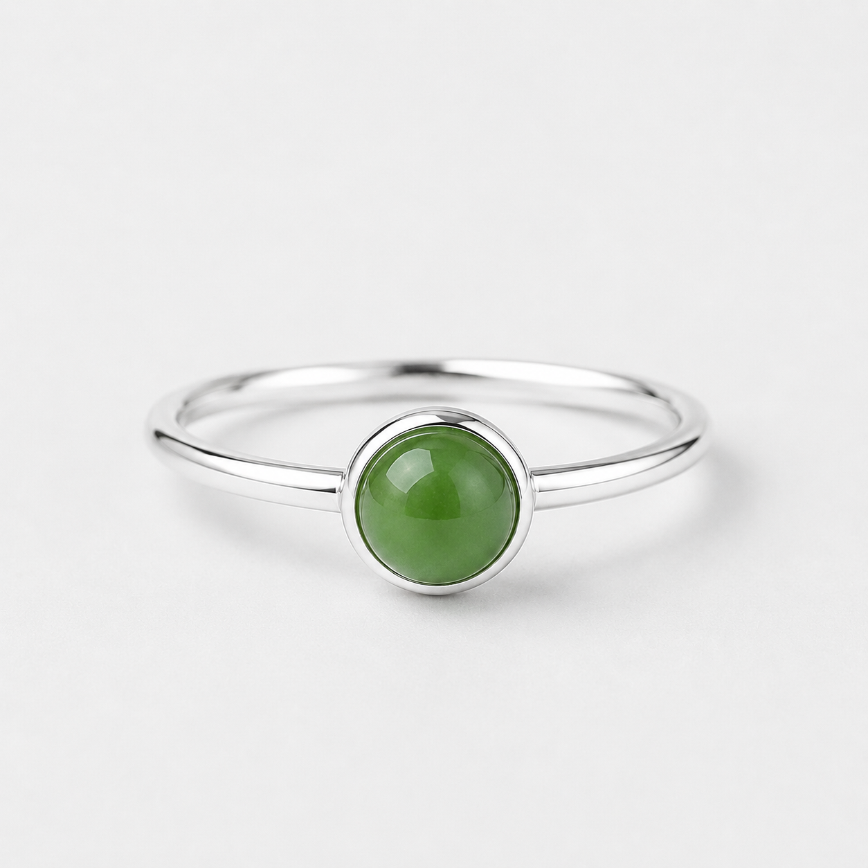 Blaise sterling silver ring with a round green nephrite jade cabochon on a clean white background.