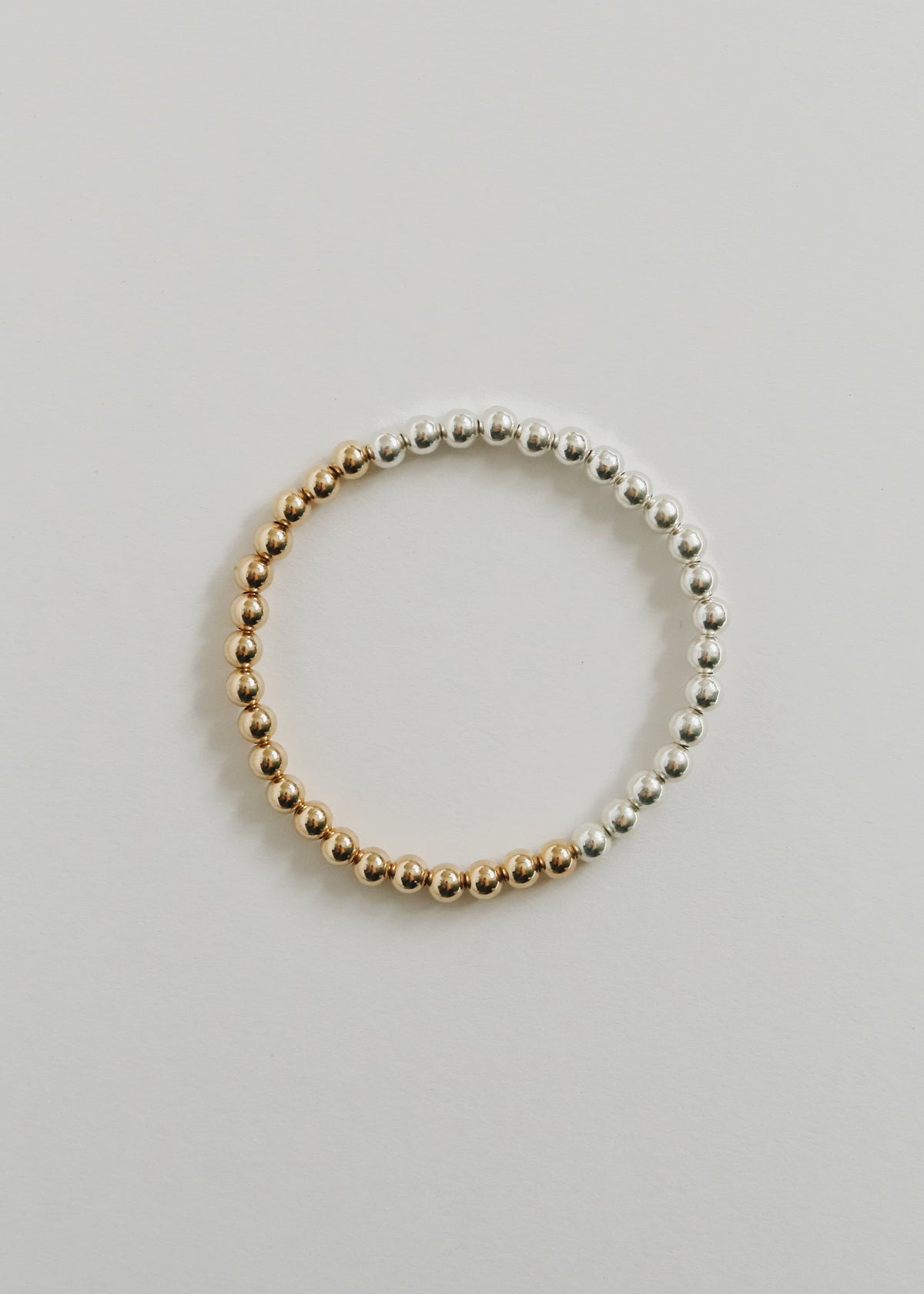 Brighton two-tone beaded bracelet made with 5 mm sterling silver and 14K gold-filled beads, from The Riann Ashlyn Collection.