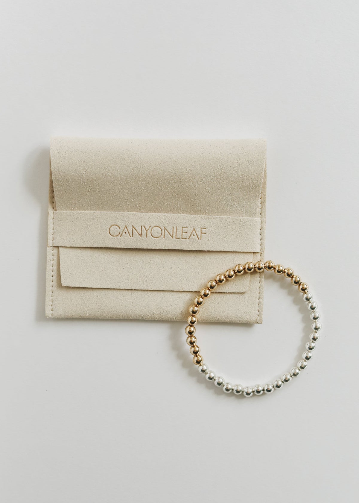 Brighton bracelet featuring polished 5 mm sterling silver and 14K gold-filled beads in a mixed-metal design, from The Riann Ashlyn Collection.