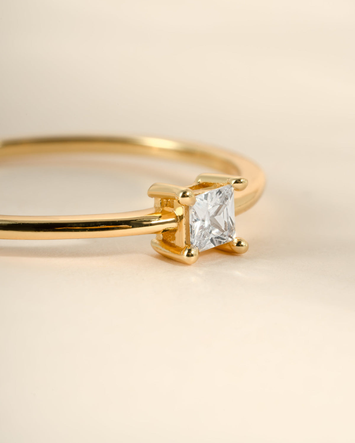 Close-up of Campbell gold ring with a 3 mm princess-cut cubic zirconia
