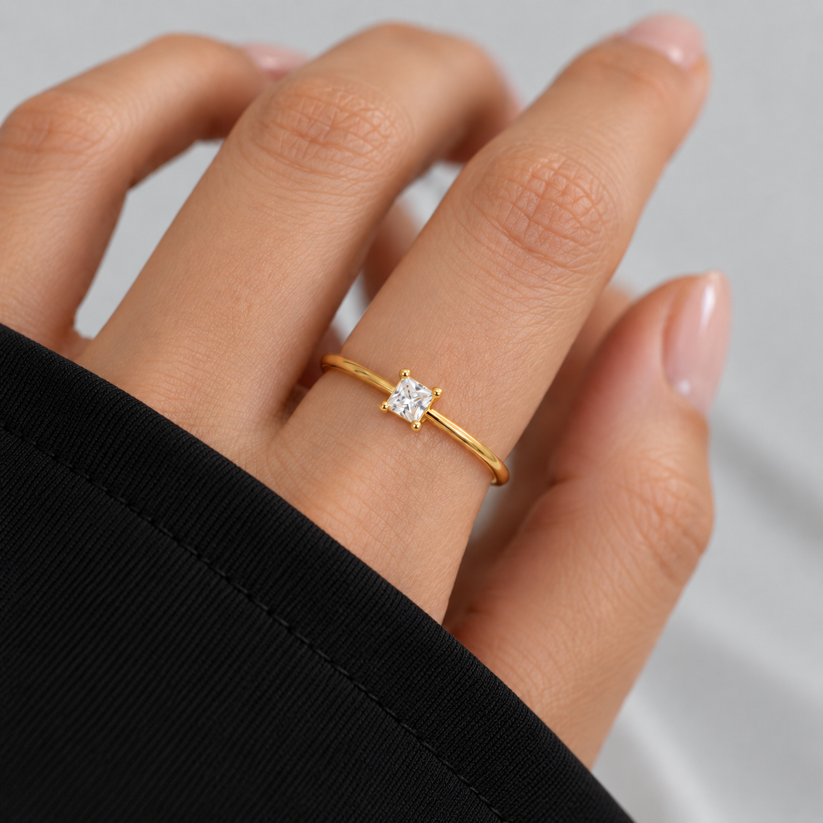     Campbell gold princess-cut cubic zirconia ring worn on a hand with a black sleeve