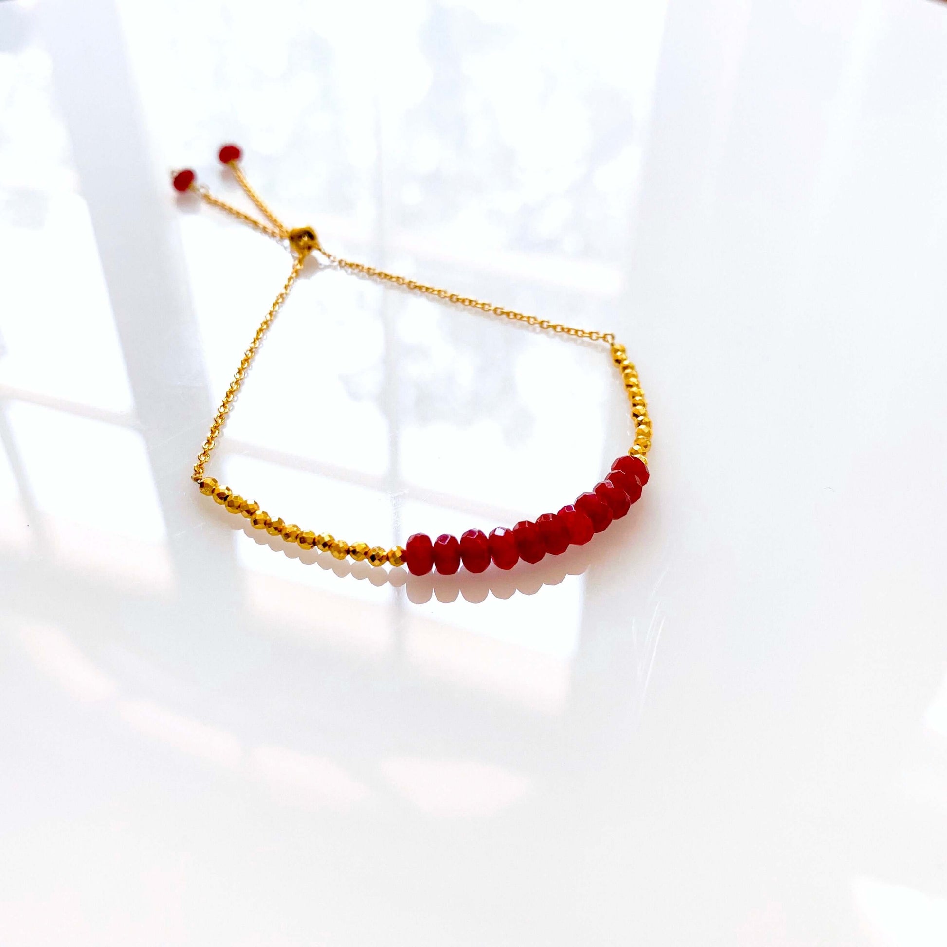 Drew red gemstone stacking bracelet with gold-tone chain and bead accents