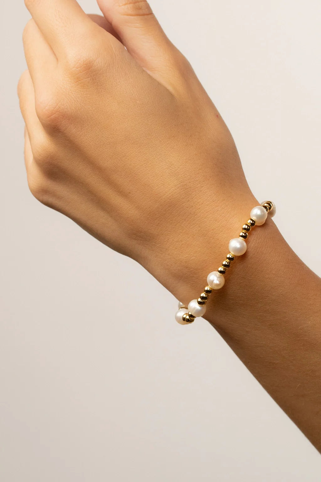 Emi pearl-look beaded stretch bracelet with polished metal accents, product photograph 10 – The Riann Ashlyn Collection