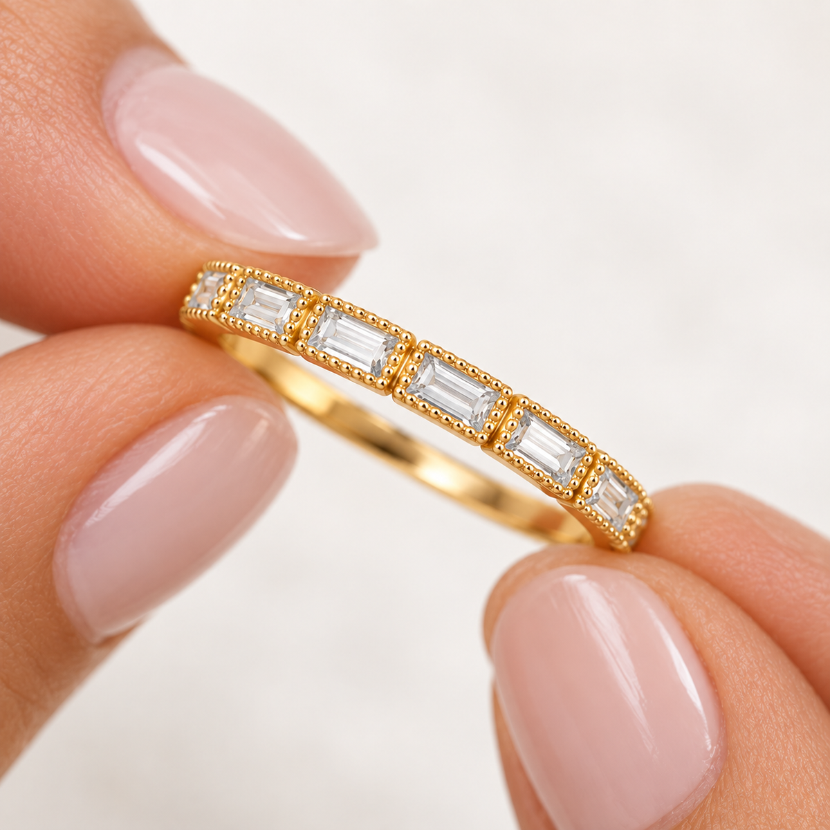 Close-up of Fallon gold-plated baguette ring showing rectangular cubic zirconia stones