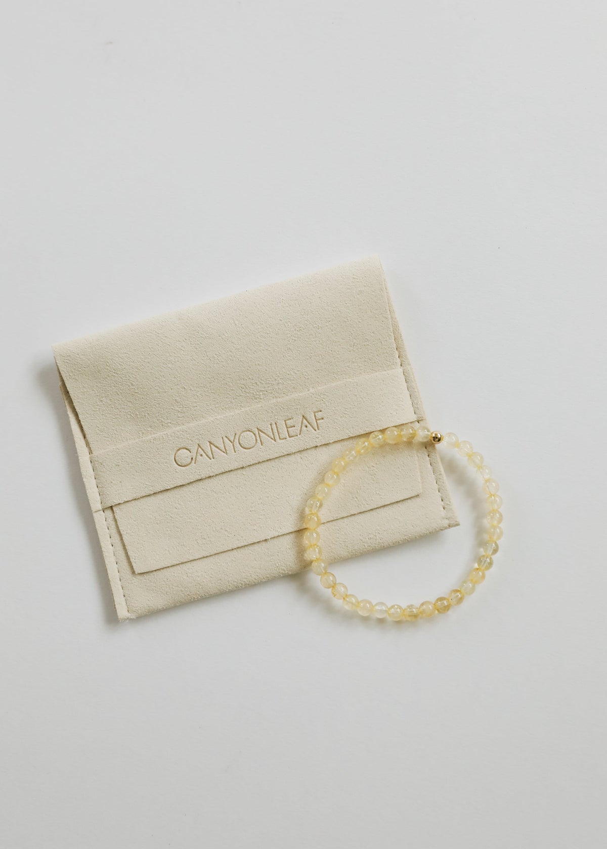 Fia citrine beaded stretch bracelet with petite 4 mm golden gemstone beads and a single 14K gold-filled accent, from The Riann Ashlyn Collection.