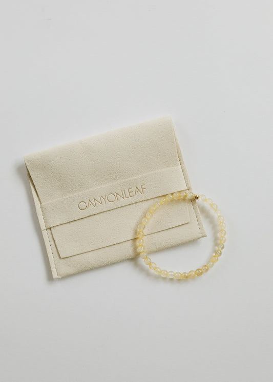 Fia citrine beaded stretch bracelet with petite 4 mm golden gemstone beads and a single 14K gold-filled accent, from The Riann Ashlyn Collection.