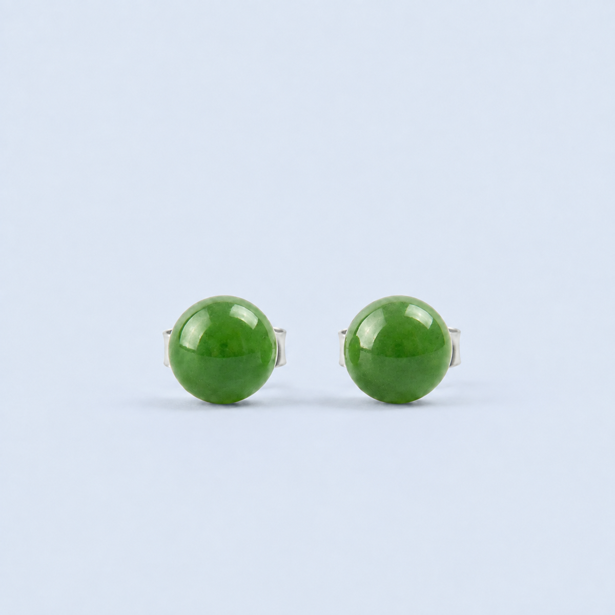     Giada Canadian jade stud earrings on an RA blue background