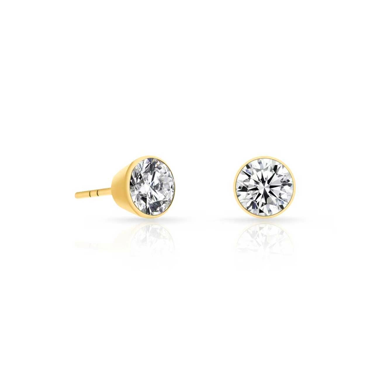 Side and front view of gold bezel-set stud earrings with round clear stones on a white background