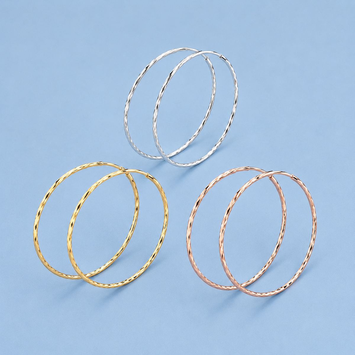 Gwen Endless Hoop Earrings shown in silver, gold and rose gold colors