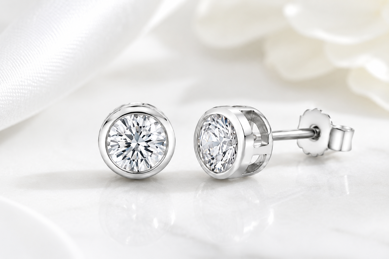 Harper sterling silver simulated diamond bezel-set stud earrings shown on a white background.