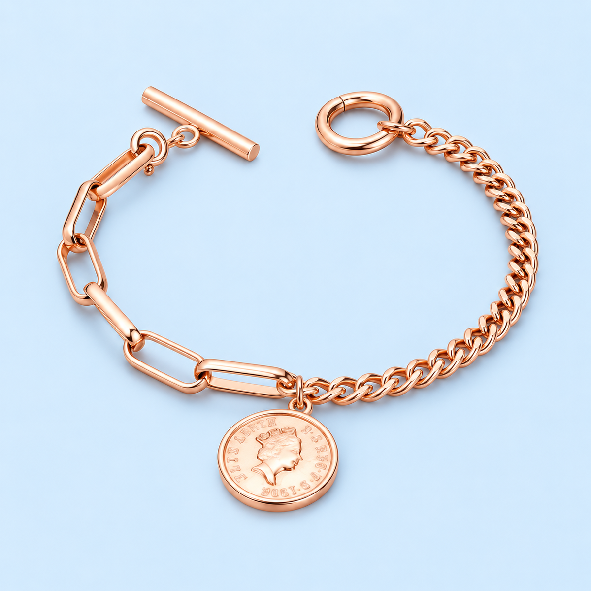Jovie rose gold mixed link coin bracelet on a pale blue background