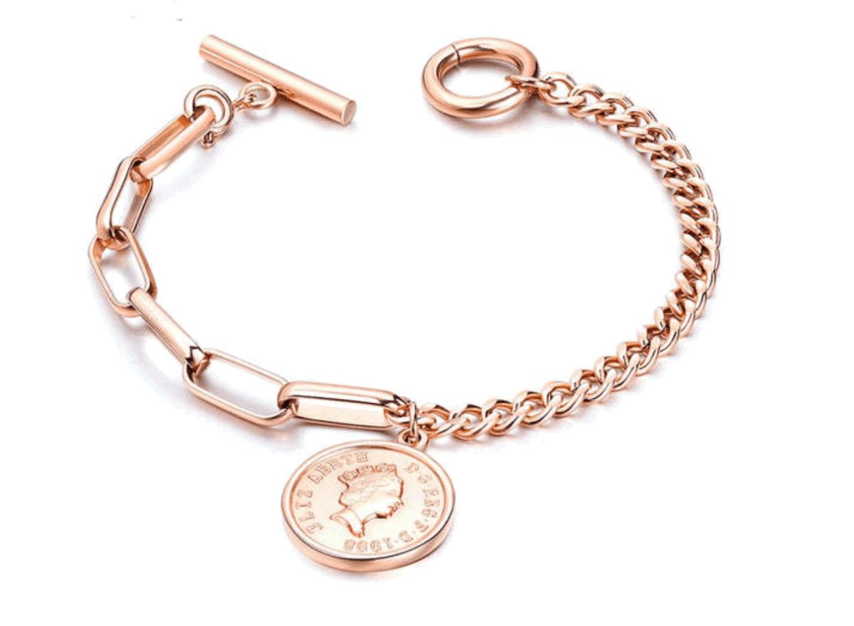 Close view of Jovie’s rose gold mixed links, coin charm, and toggle clasp
