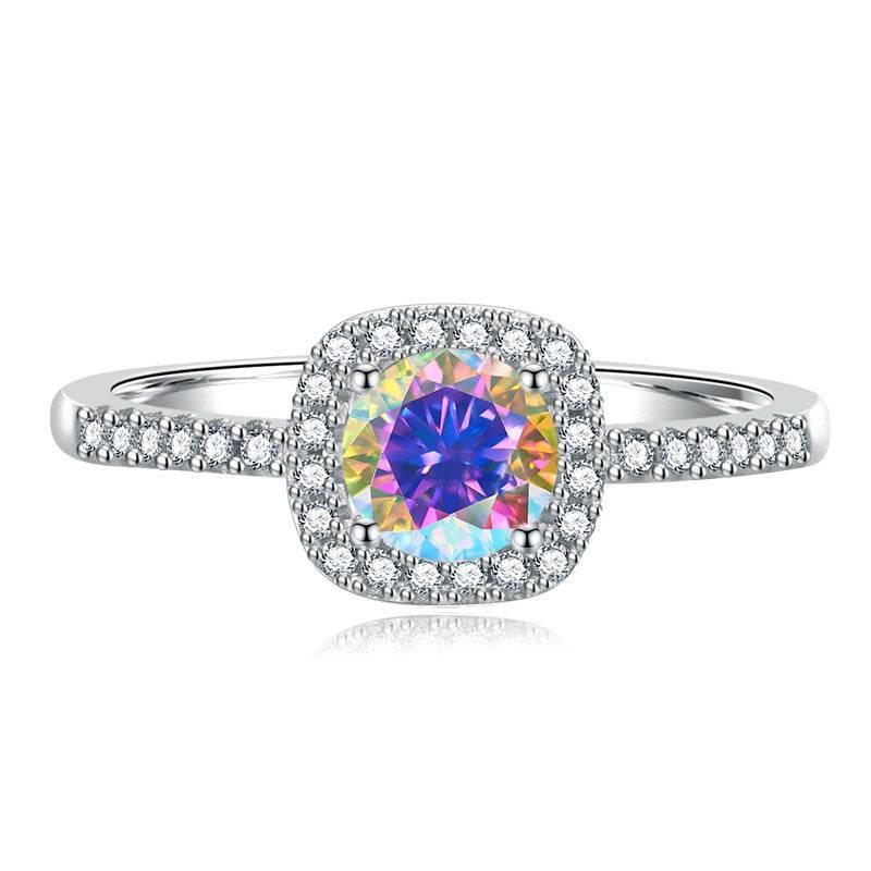Madison sterling silver halo ring with an Aurora Borealis moissanite center stone and pavé-set band on a white background.