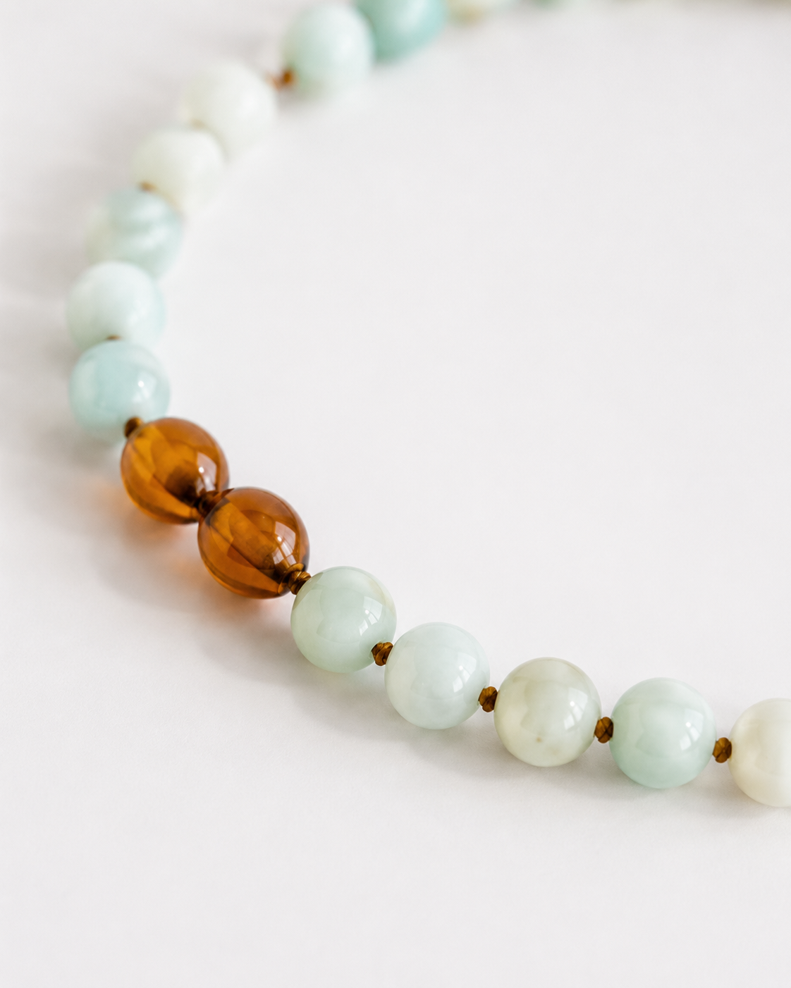 Maren Amazonite Gemstone Necklace from The Riann Ashlyn Collection showing the pale aqua amazonite beads and warm brown accent beads.
