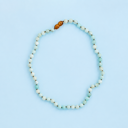 Maren Amazonite Gemstone Necklace from The Riann Ashlyn Collection displayed flat to show its blue-green gemstone beads and brown accents.