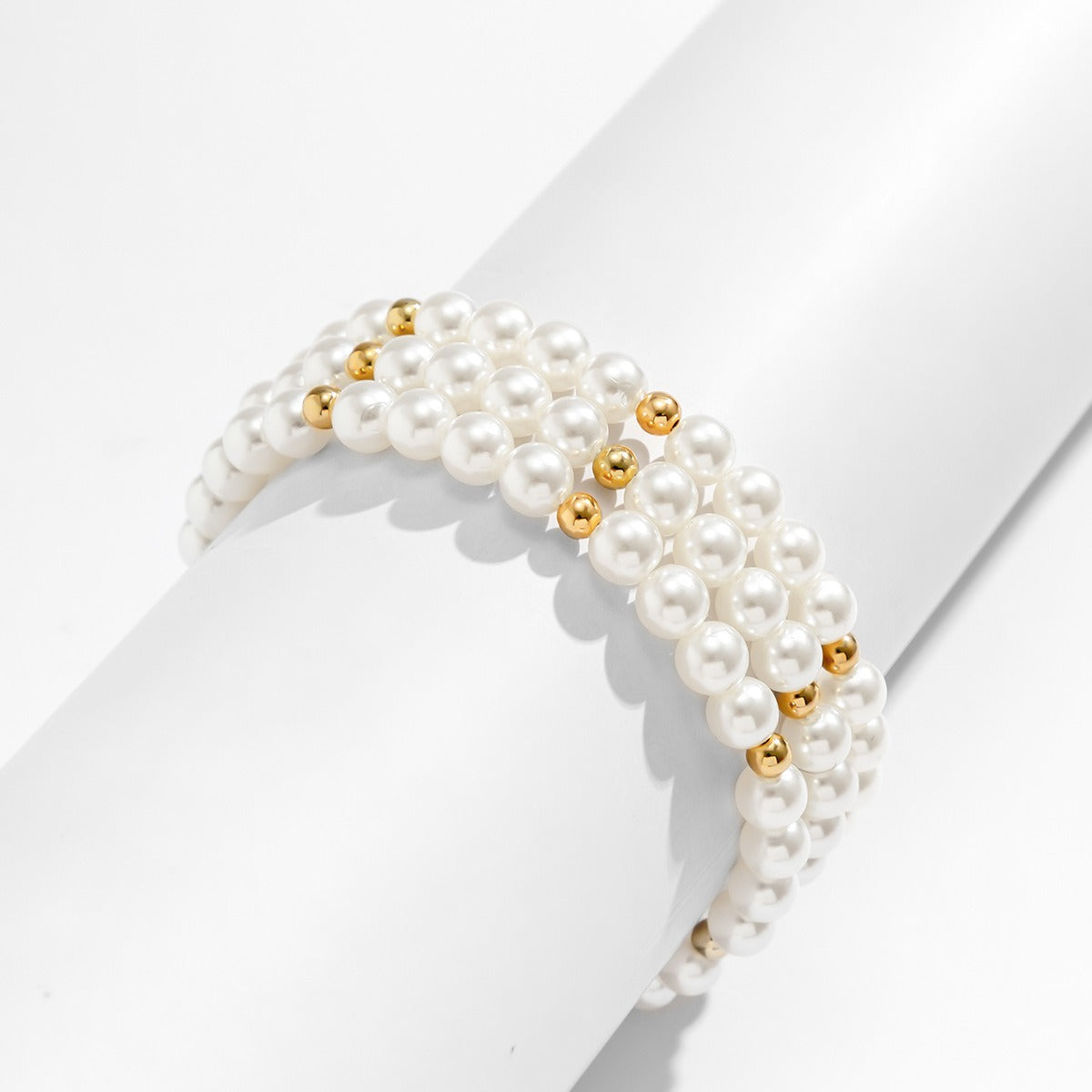 Maris Four-Row Faux Pearl Anklet — layered imitation pearl anklet, image 3. The Riann Ashlyn Collection.
