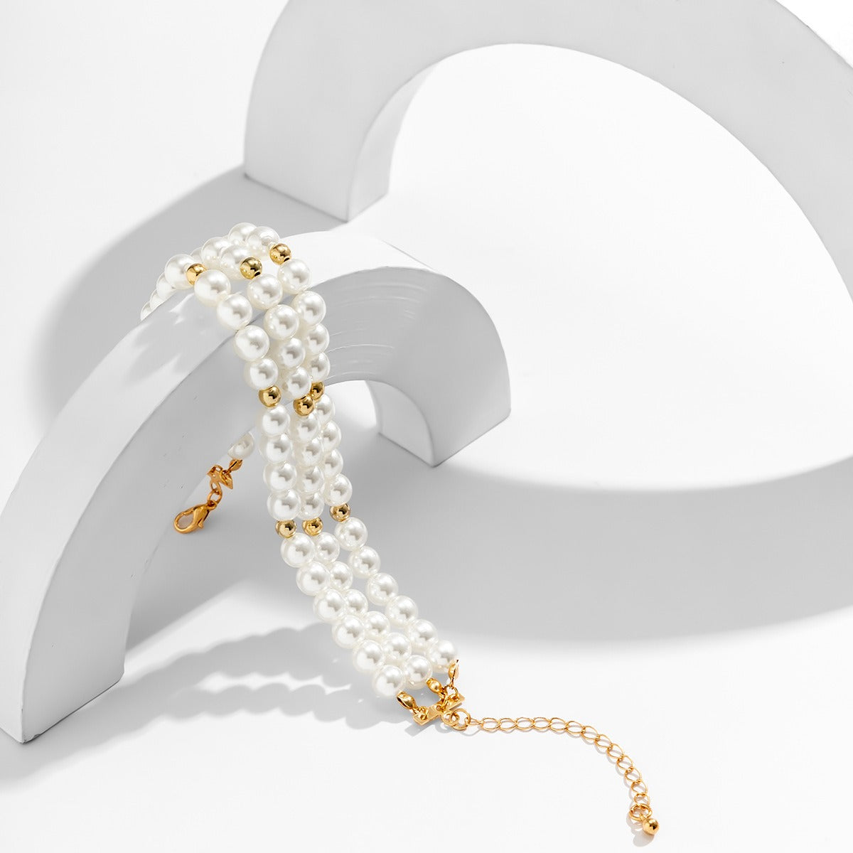 Maris Four-Row Faux Pearl Anklet — layered imitation pearl anklet, image 4. The Riann Ashlyn Collection.
