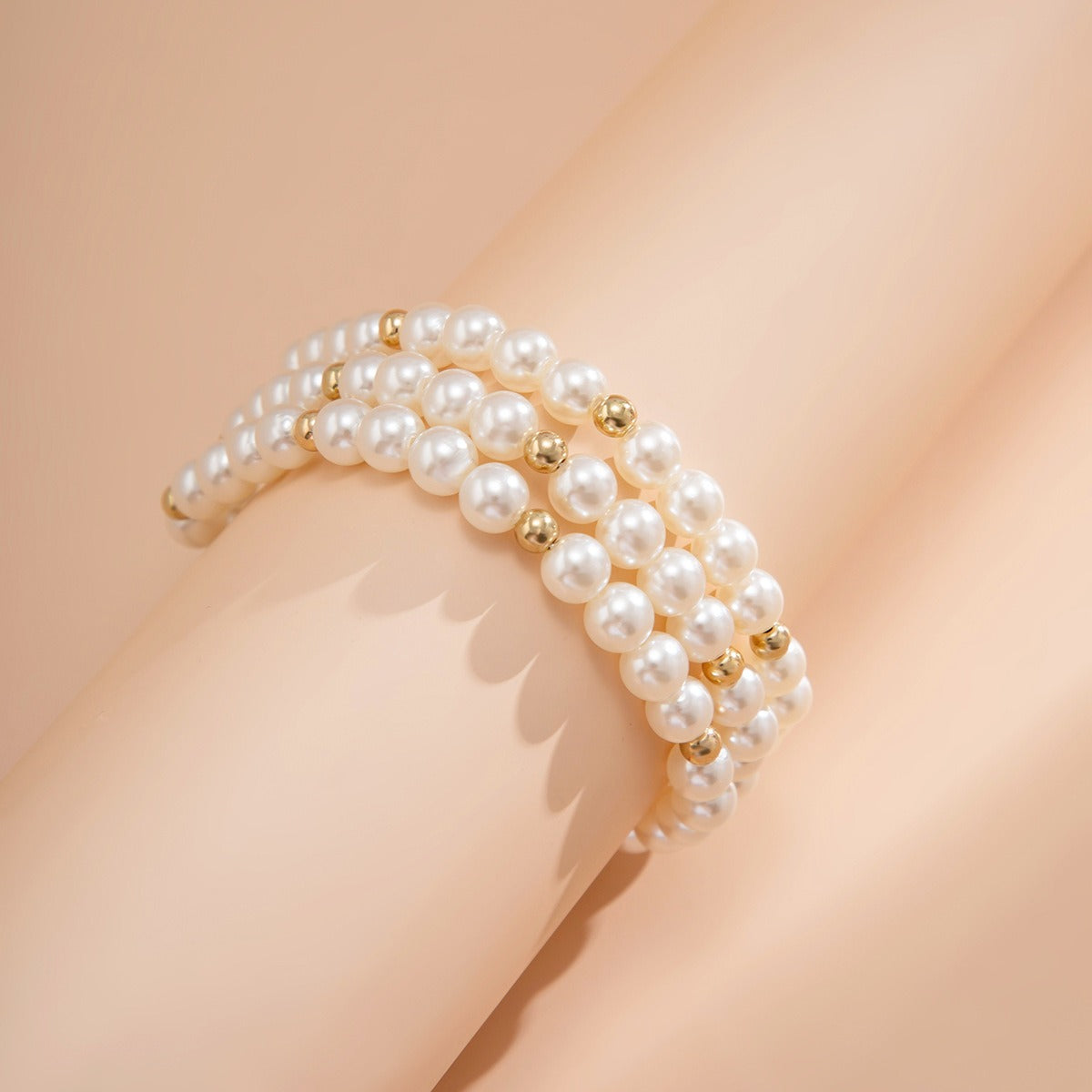 Maris Four-Row Faux Pearl Anklet — layered imitation pearl anklet, image 6. The Riann Ashlyn Collection.