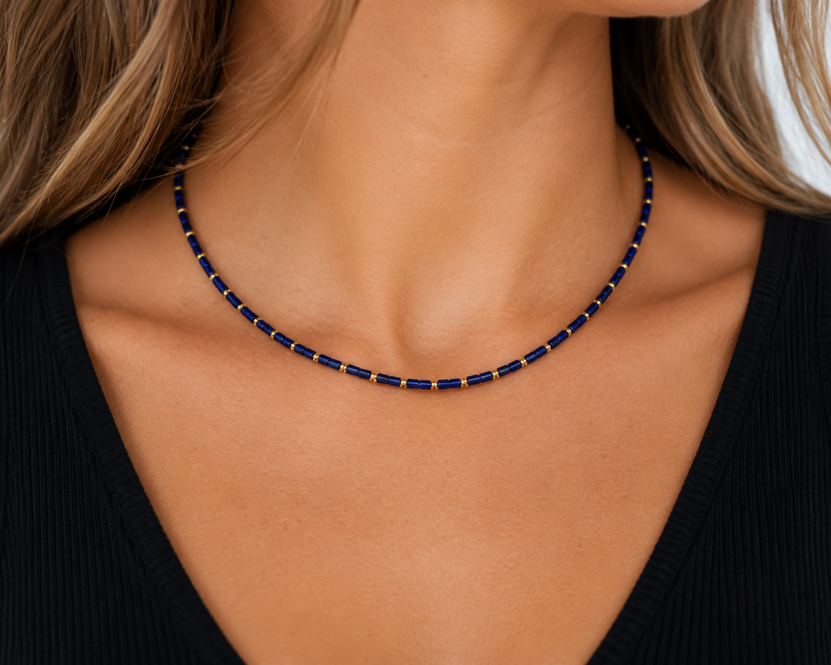 Model wearing the Navy Lapis Necklace with genuine lapis lazuli beads and 18K gold-plated details.