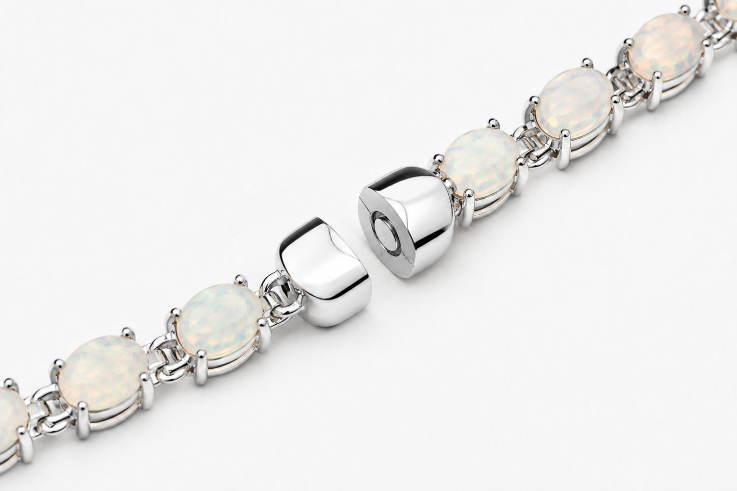 Ophelia white opal tennis bracelet with silver clasp and oval prong-set stones