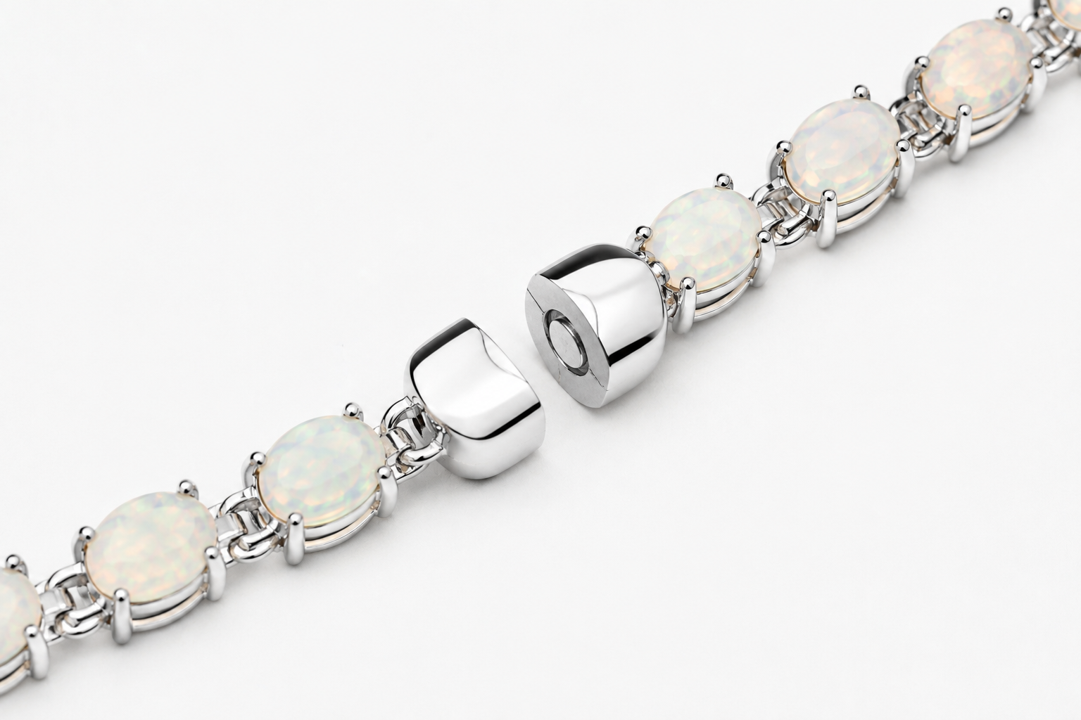 Ophelia white opal tennis bracelet with silver clasp and oval prong-set stones