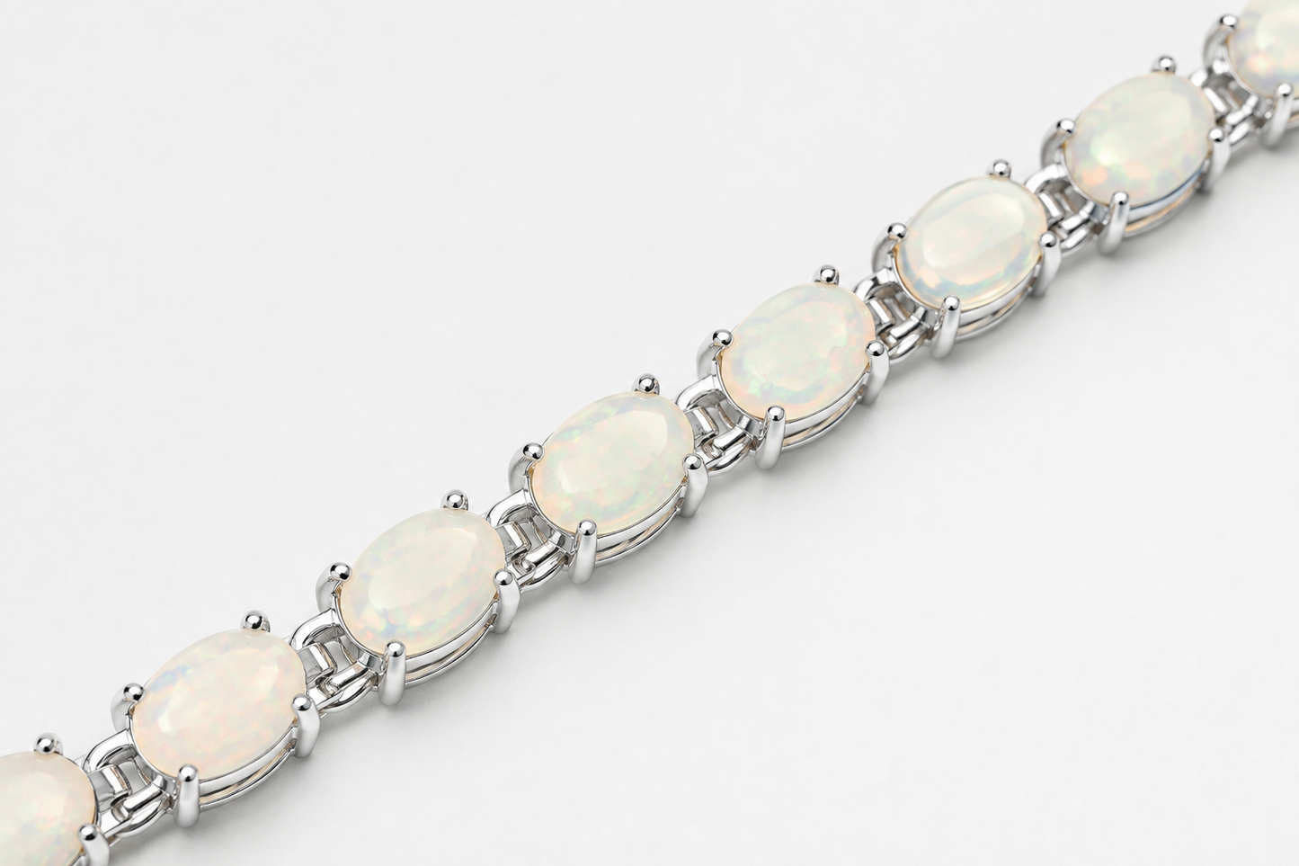 Ophelia white opal tennis bracelet with oval stones in silver prong settings