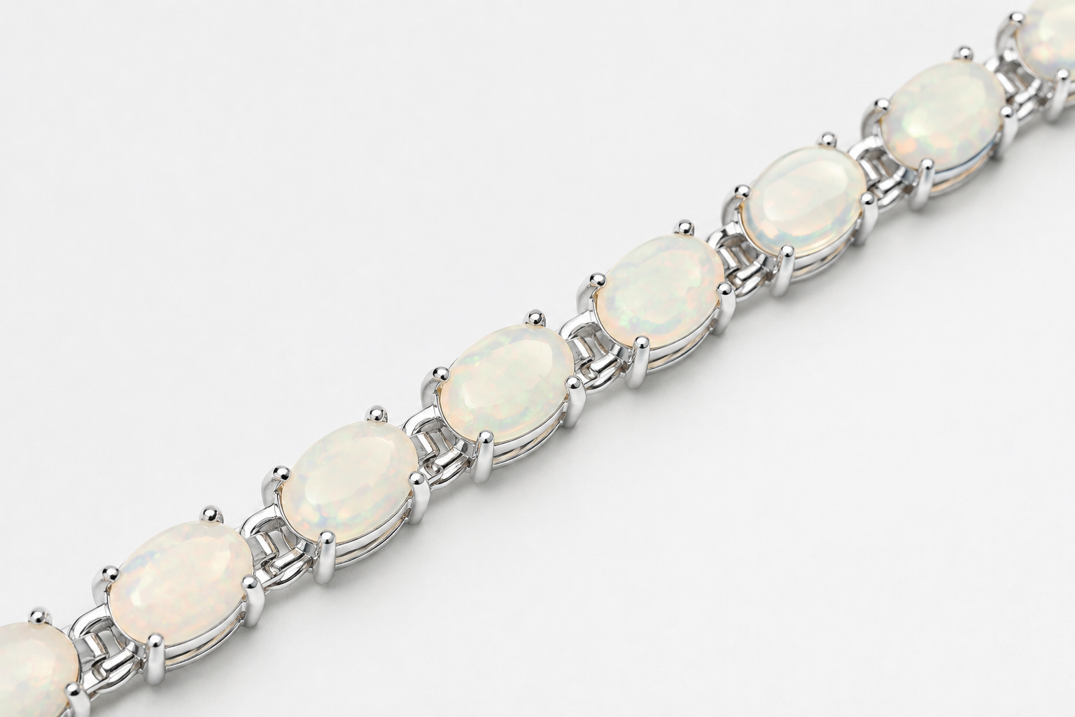 Ophelia white opal tennis bracelet with oval stones in silver prong settings