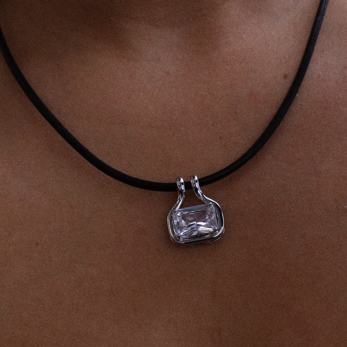 Model wearing Palmer black leather cord cubic zirconia pendant necklace