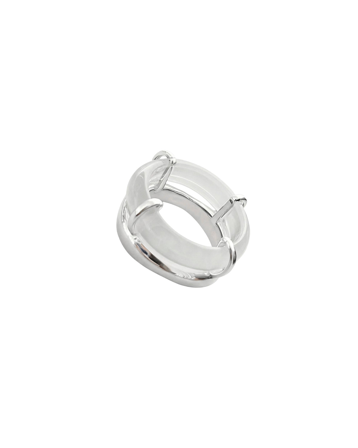 Rhodes white chalcedony sculptural ring featuring a curved white stone and polished silver-tone setting on a white background.