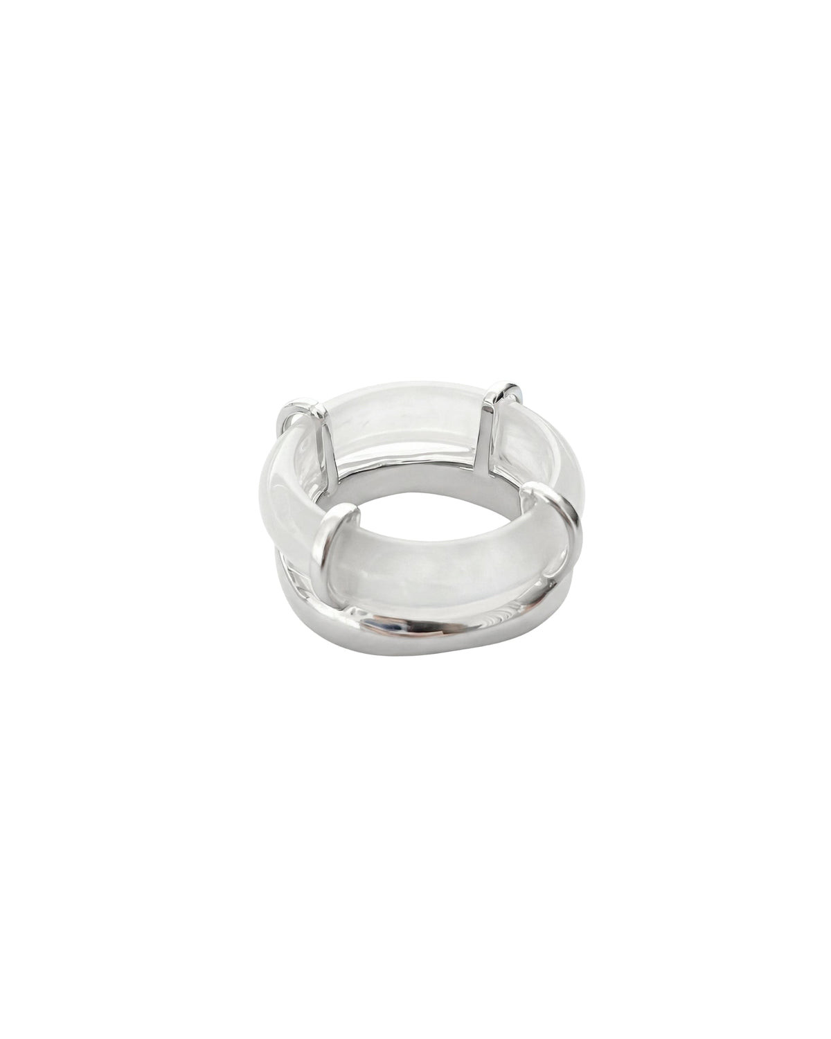 Rhodes white chalcedony sculptural ring featuring a curved white stone and polished silver-tone setting on a white background.