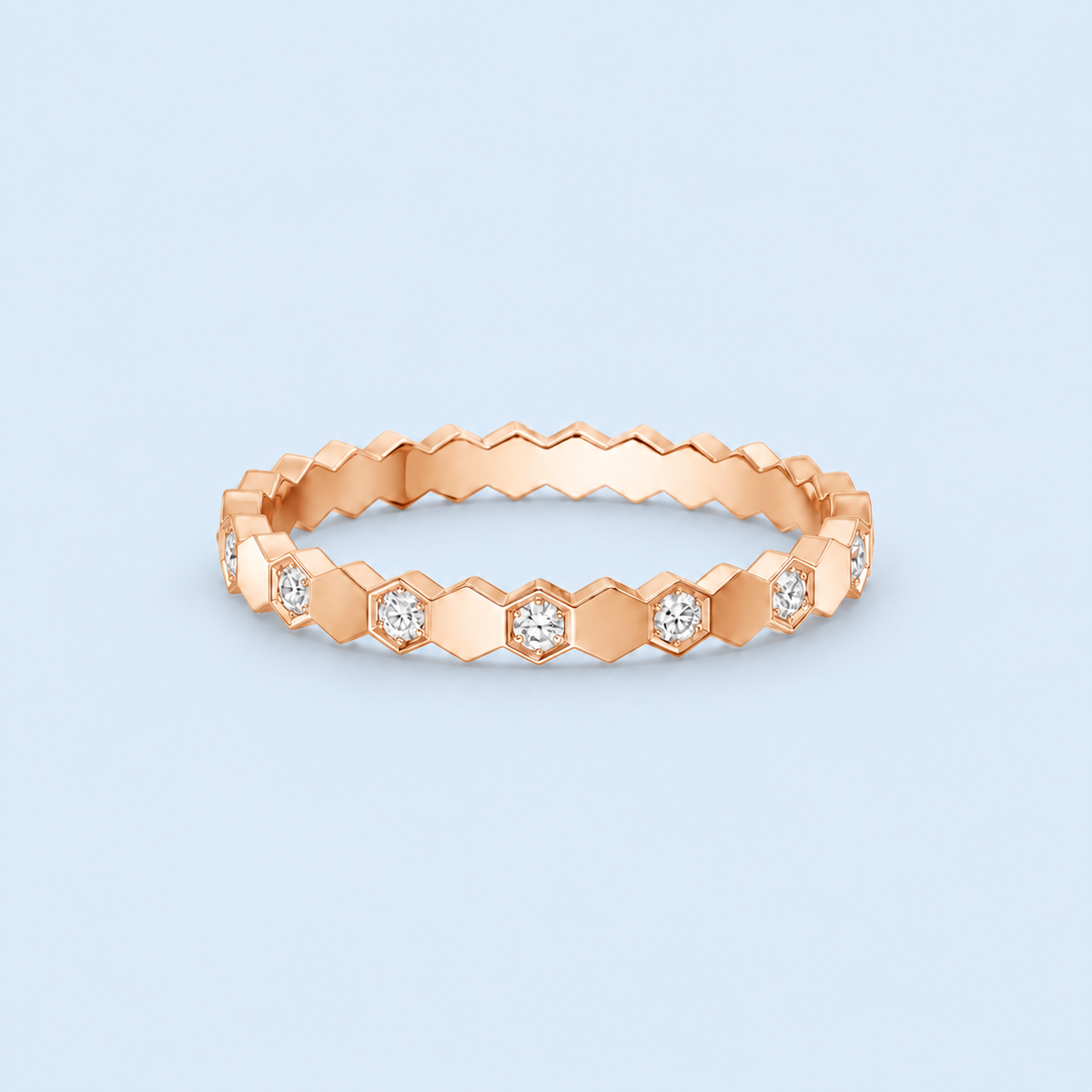 Romy rose gold hexagon pavé ring with clear stones on Riann Ashlyn blue background