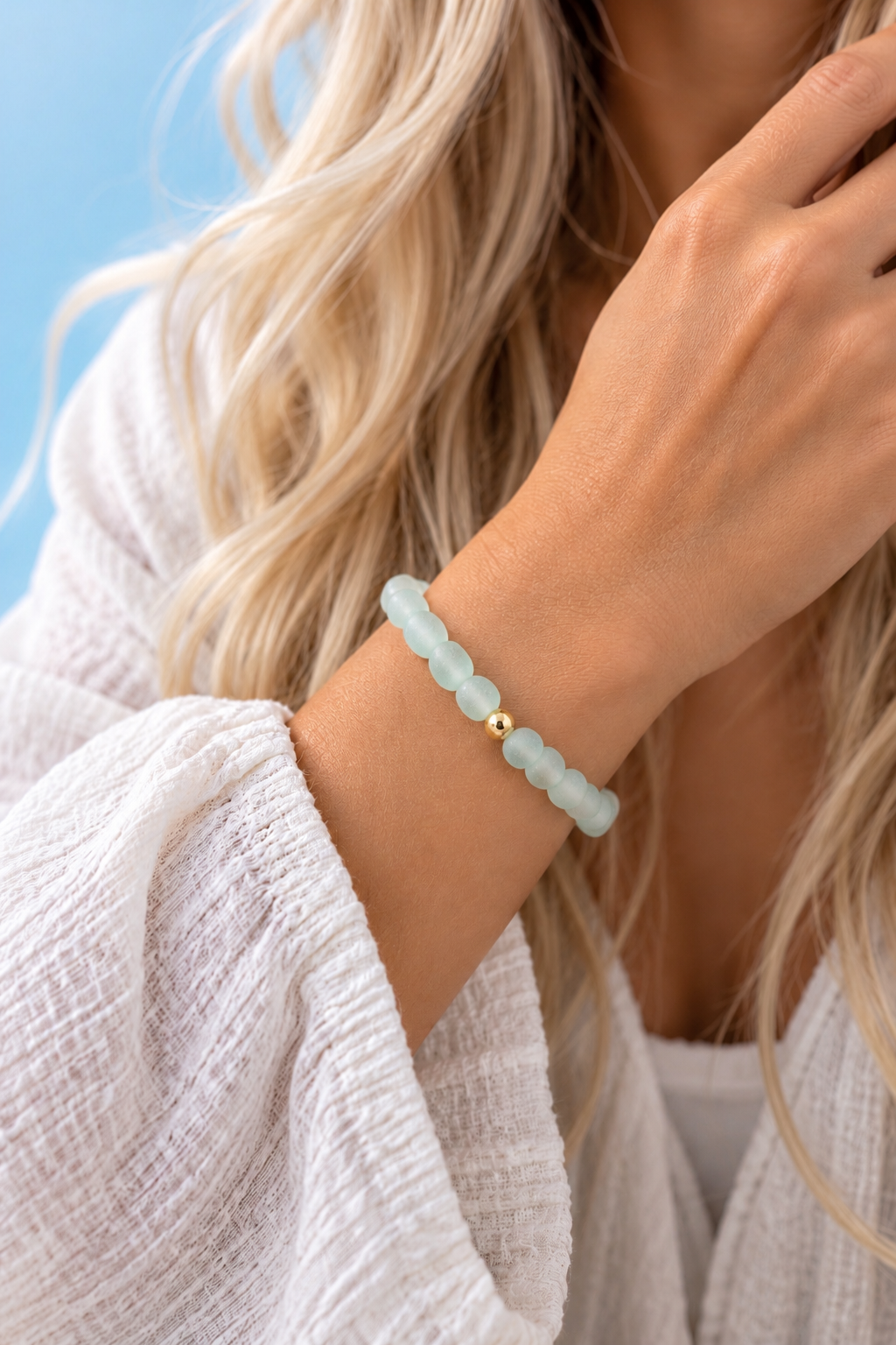 Close-up of Sora's irregular frosted blue-green sea glass beads and single polished gold-filled accent — The Riann Ashlyn Collection.
