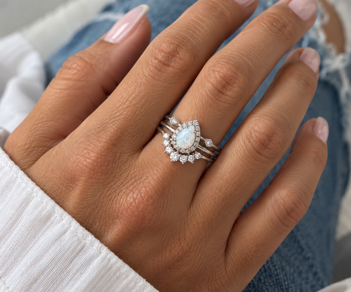 Sutton silver pear opal ring set worn on hand