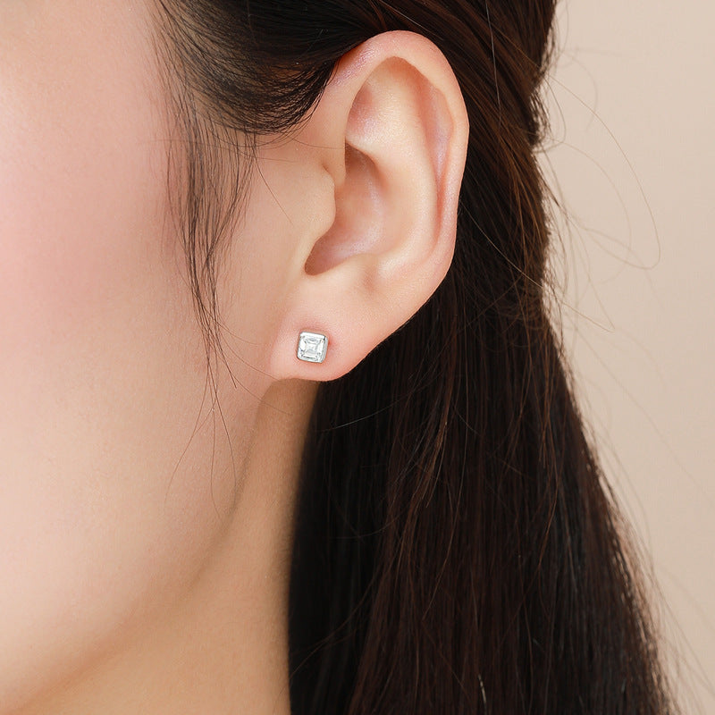     Brunette model wearing Taryn square cubic zirconia stud earrings in Silver