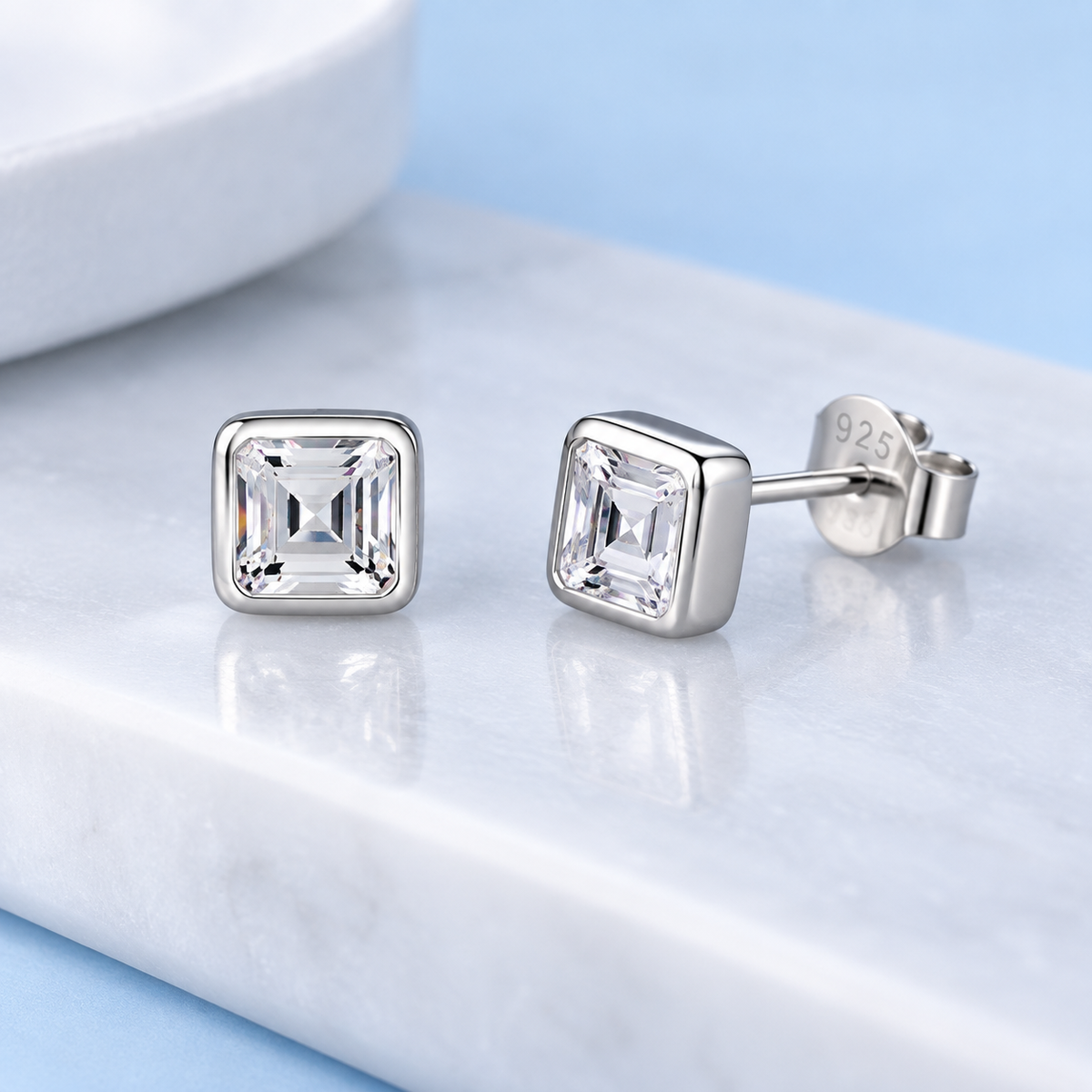     Close-up of Taryn square cubic zirconia stud earrings in Silver showing the stud post and backing
