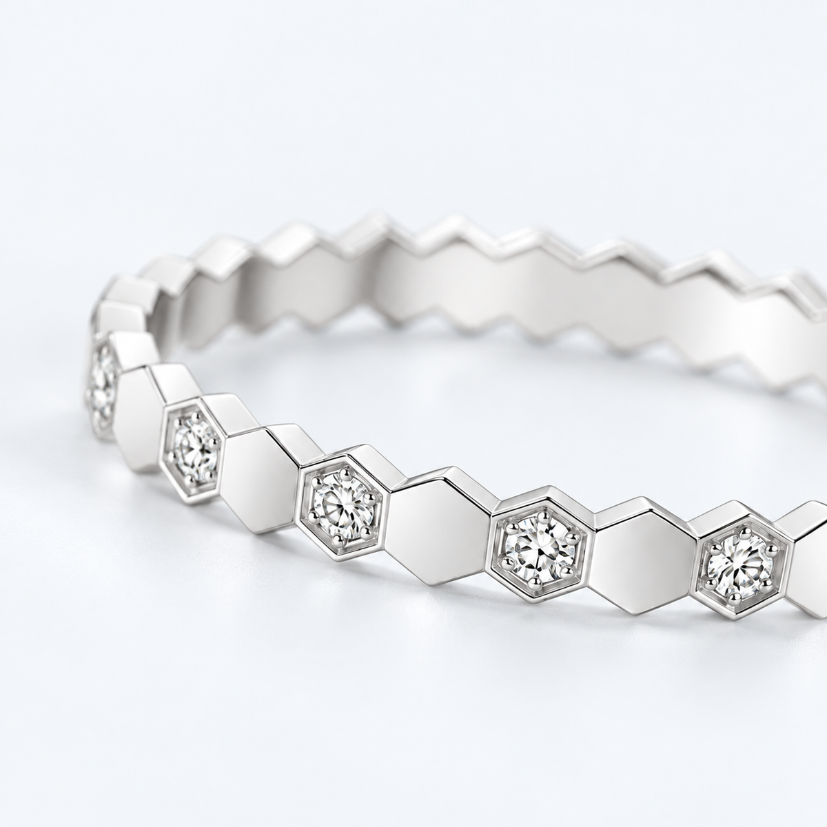         Close-up of Vale hexagon pavé ring with alternating diamond-alternative stones