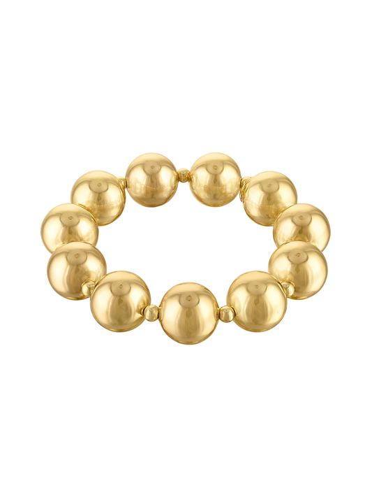 Wynter bold gold-tone stretch bracelet with large polished round beads and smaller spacer beads on a white background.